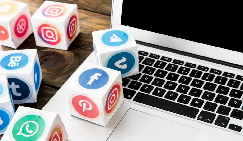 most popular social media platforms mobile app icons with laptop office