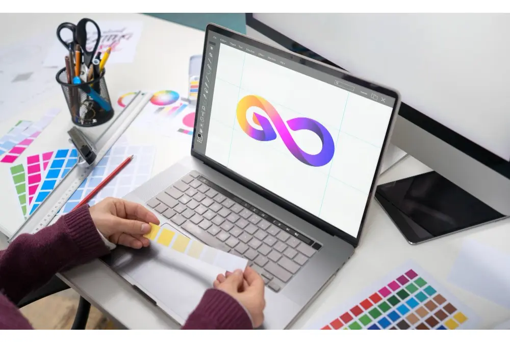 Woman Using a Graphic Design Desktop Software in a Laptop